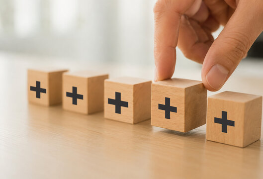 Positive things%3B added value  benefits  additional  personal development  growth mindset  positive thinking  opportunities  emerging market. Putting the cubes with plus sign to offer positive things