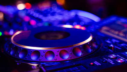 Professional dj mixer controller with lights at nightclub party close up © Ruslan