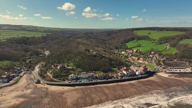 Aerial Video Sandsend Yorkshire UK. The origins of Sandsend date back to the development of the alum industry. There was a railway line linking Whitby to Teesside; the railway station opened in 1883.