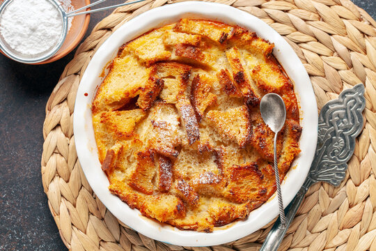 Homemade easy sweet dessert. Bread pudding in baking pan