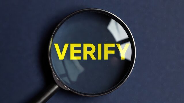 Magnifying glass verifying document with yellow verify text for business accuracy and trust concept