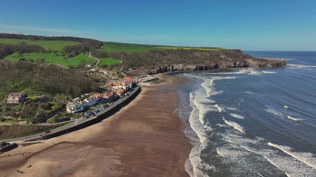 Aerial Video Sandsend Yorkshire UK. The origins of Sandsend date back to the development of the alum industry. There was a railway line linking Whitby to Teesside; the railway station opened in 1883.