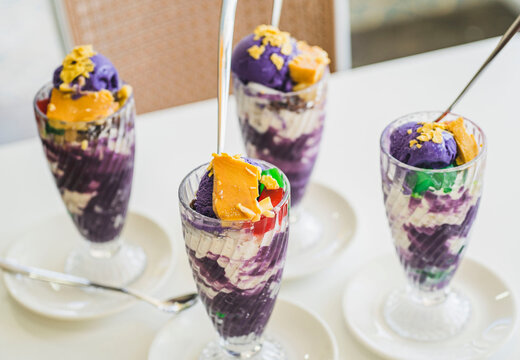 Filipino Sweet Treats - Multiple Glasses of Colorful Halo-Halo on White Table