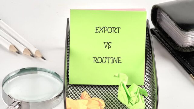 A green sticky note on an office desk gradually shows the words export vs routine next to a magnifying glass, white pencils, and a black binder