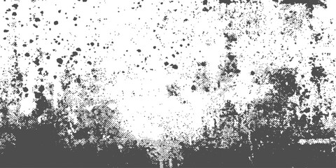 An abstract grunge background featuring black ink splats and dark paint splashes on an old vintage paper texture with a dirty floral border design © hossain
