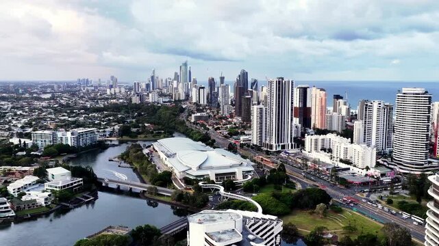 Riverside sunset at Gold Coast high-rise towers cityscape on Pacific coast of Australia.