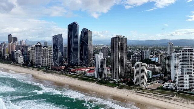 Aerial panorama of Gold Coast pacific ocean waterfront beaches towers from sea.