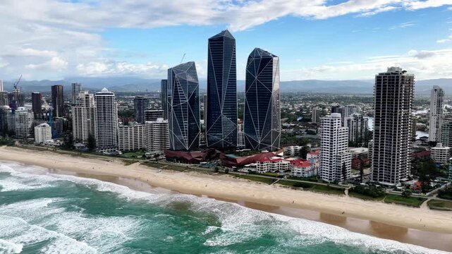 Panning from Pacific ocean waterfront of Gold Coast Surfers paradise Australia.