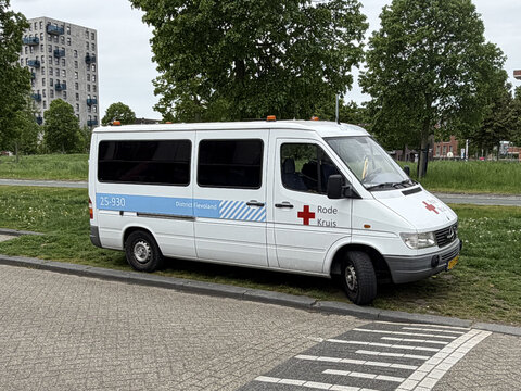 Almere, the Netherlands - May 6, 2026: Dutch red cross van parked by the side of the road. nobody in the vehicle.