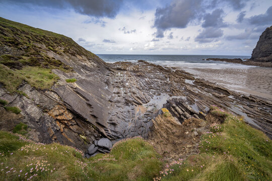 Crackington Haven folded layers of dark bluey grey mudstones, shales, and sandstones