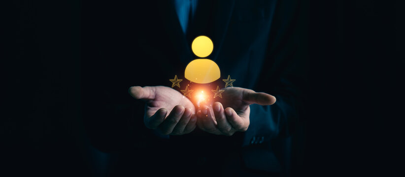Business professional holding digital customer satisfaction icon with rating stars representing client experience feedback review system service quality evaluation and loyalty management concept