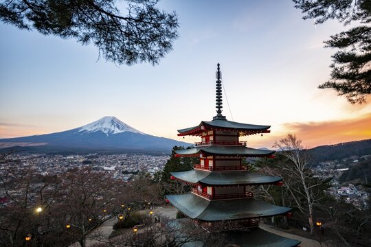 Five-story pagoda of a Shinto Shrine, Chureito Pagoda, with views of Fujiyoshida City and Mount Fuji volcano at sunset, Arakura Fuji Sengen Shrine, Arakurayama Sengen Park, Yamanashi Prefecture, Japan