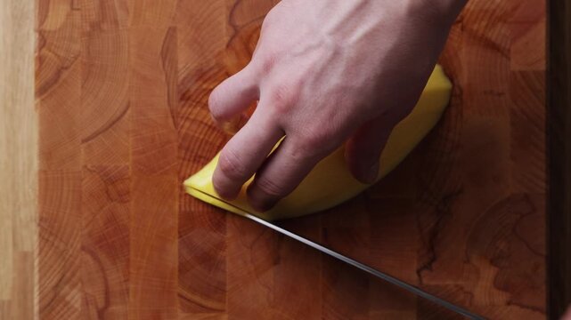 Slicing Fresh Mango Into Thin Slices Top View
