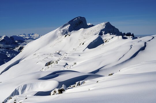Summit of the Toreck with snow cornices and blue sky, Ritzlern, Kleinwalsertal, Vorarlberg, Austria