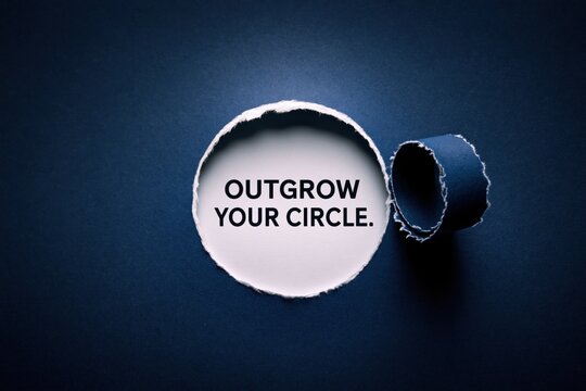 Outgrow Your Circle motivational concept appearing in a ripped paper hole