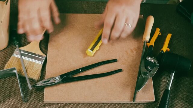 a man collects tools