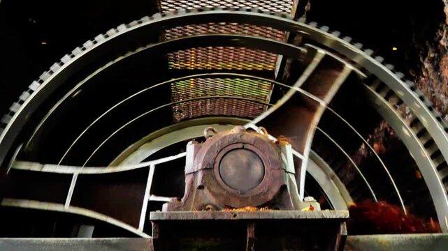 Industrial palm oil processing machine with rotating metal drum for fresh fruit bunch threshing in a mill facility