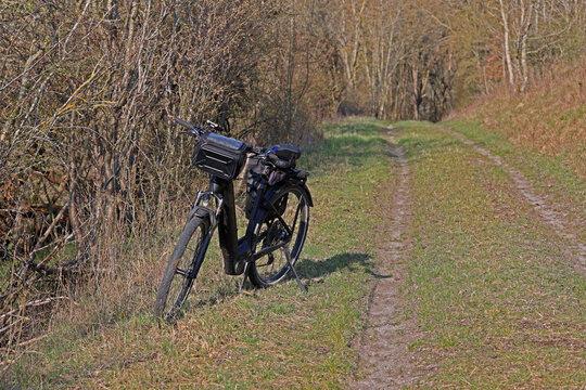 The bicycle is standing in nature