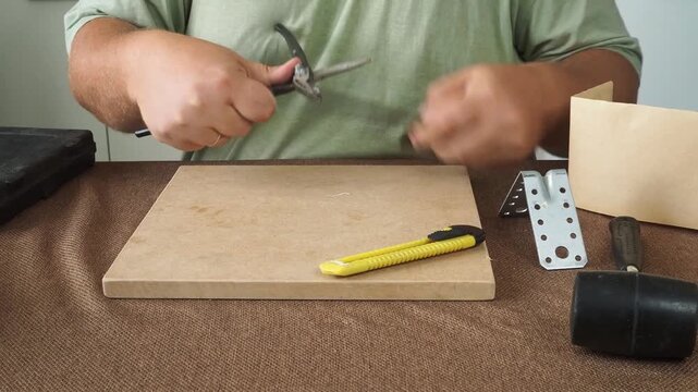 A man is doing repairs.
