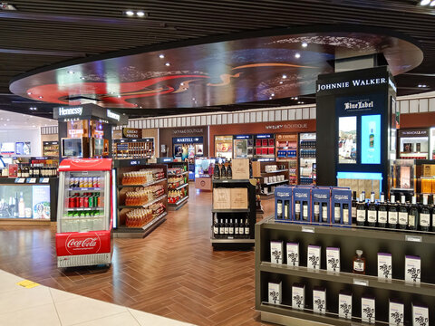 Phnom Penh, Cambodia - March 1, 2025: Interior of a retail store  selling a variety of alcohol, liquor, and tobacco products in the duty free shop at Phnom Penh International Airport in Cambodia.