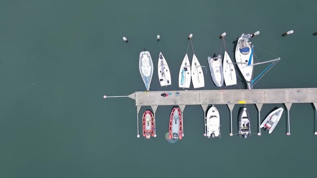 Abstract vertical aerial view of marina harbor docks and boats