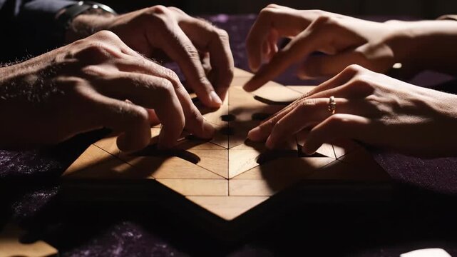 In an intimate setting illuminated by gentle, warm light, hands eagerly come together to fit intricate wooden pieces into a stunning puzzle.