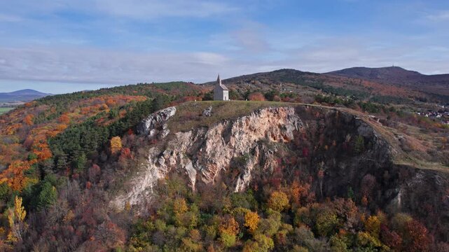 Flying around of Drazovce church (Church of St. Michael the Archangel) at autumn day, Nitra, Slovakia