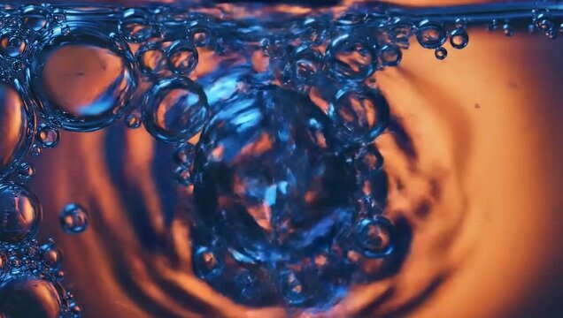 Macro Close Up Of Blue And Orange Bubbles In Water abstract background
