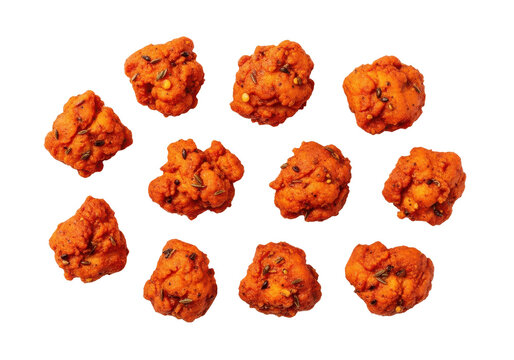 Crispy fried pakora or fritters with spices and cumin seeds, isolated on transparent background