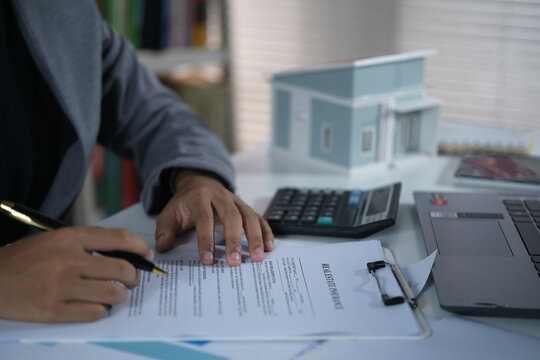 Signing home sales and insurance contracts with real estate agents, signing contracts to know the terms of buying and selling homes and real estate, contract signing ideas.
