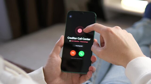 Cinematic shot of financial stress as a man receives an incoming call from a debt collection agency. Realistic UI shows Creditor Call Center. Ideal for content on debt relief, banking, and economic