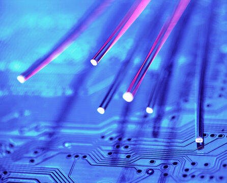 Glowing fibre optics on a blue circuit board for data communications
