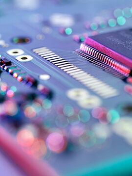 Close up of a colorful electronic circuit board and microchip