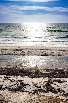 Scenic beach landscape with sunlight reflecting on the Baltic Sea