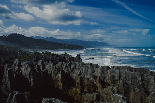 Scenic New Zealand coastal landscape with dramatic rock formations
