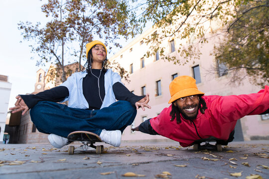 Playful skateboarder having fun on the street in Barcelona