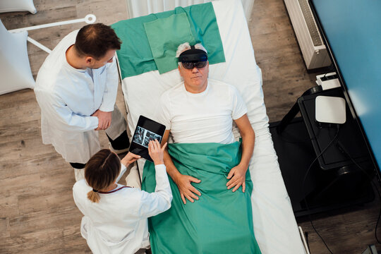 Doctor consulting a patient using virtual reality and AI technology in a medical examination