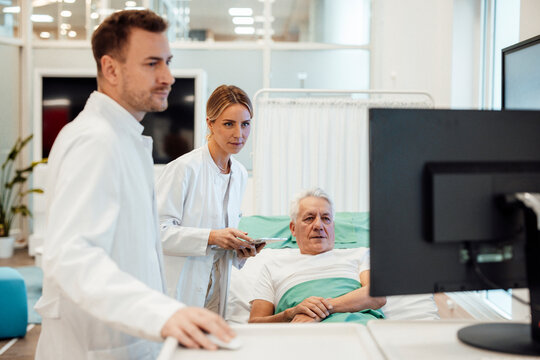Doctors consulting with a patient in a modern medical office