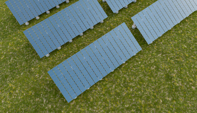 Aerial view of a solar farm in a green field outdoors