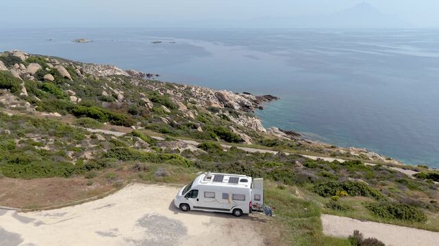 Experience the beauty of Chalkidiki Greece as a cozy camper overlooks the crystal-clear waters. Relax on the picturesque coastline and embrace the peaceful atmosphere of this hidden gem.