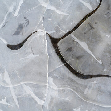 Abstract close up of cracked frozen ice surface