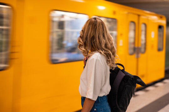 Passenger with backpack waiting at Berlin underground platform