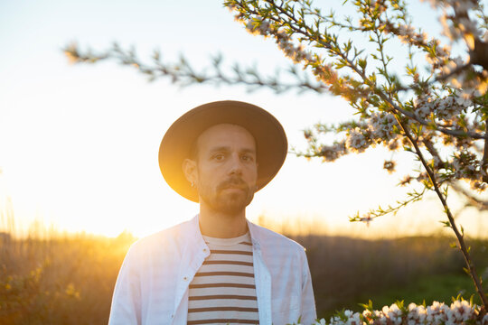 Peaceful portrait with hat during spring sunset in Lleida Spain