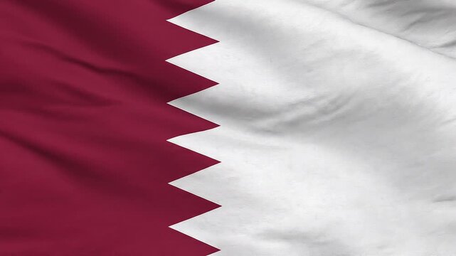 Qatari flag waving gently in clear sunlight