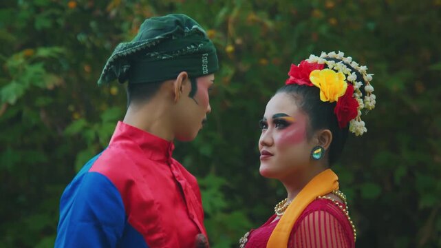 Close-Up Portrait of Indonesian Dancers Gazing at Each Other with Makeup
