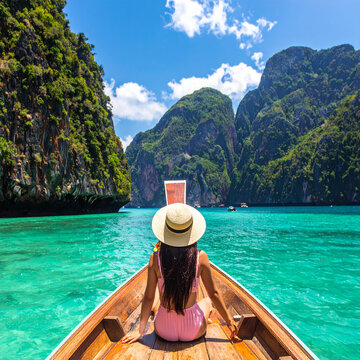 Woman on longtail boat in tropical sea