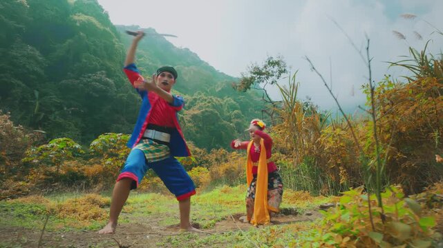 Traditional Indonesian Dancers Performing in Mountain Landscape