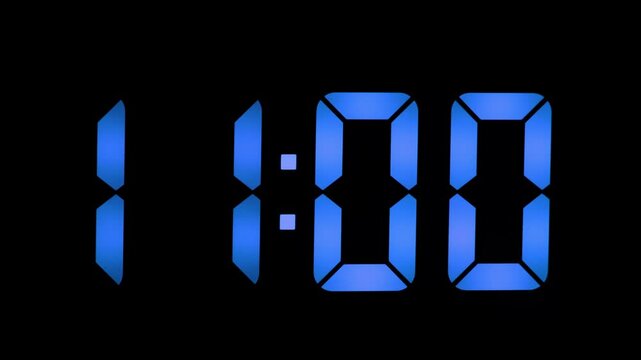 Blue digital clock numbers illuminated on black background displaying time 10:59 in a seven-segment style format typical of electronic clocks and timers.