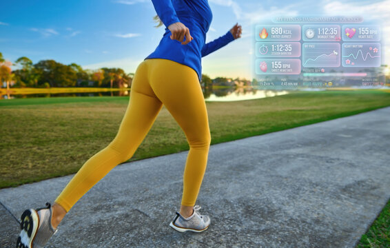 Running outdoor with futuristic holographic fitness tracker overlay