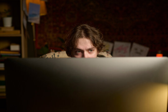 Freelancer working late at night on a computer from home